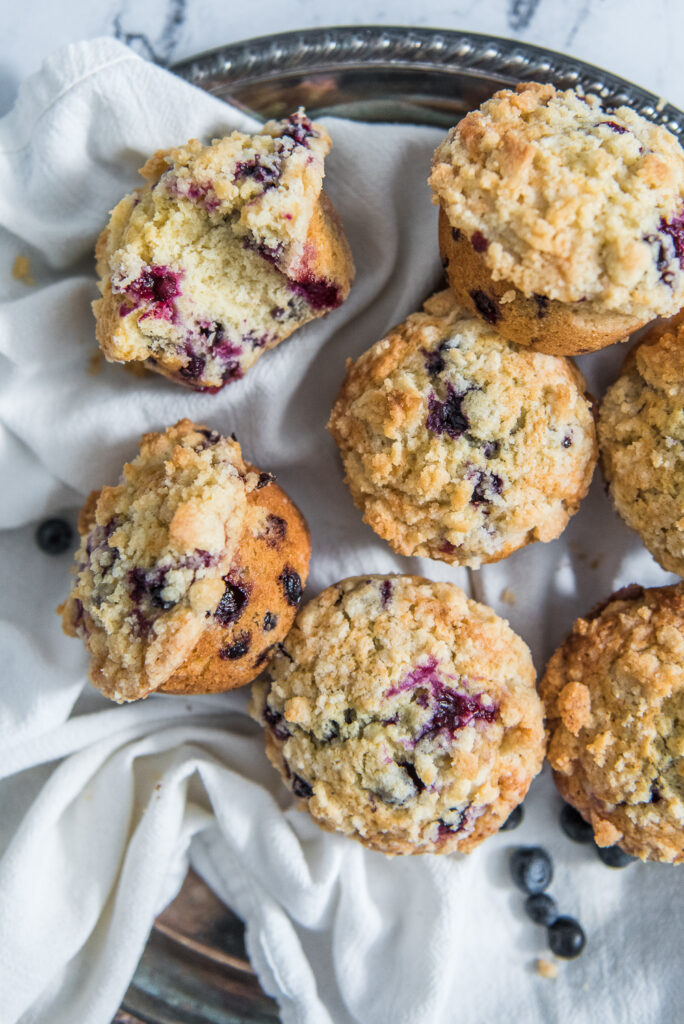 Blueberry muffins with crumb topping, shot by food photographer Rebecca Hales