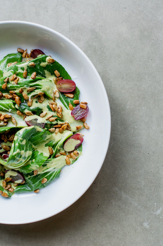 Bok Choy salad with grapes and sunflower seeds, shot by food photographer Rebecca Hales