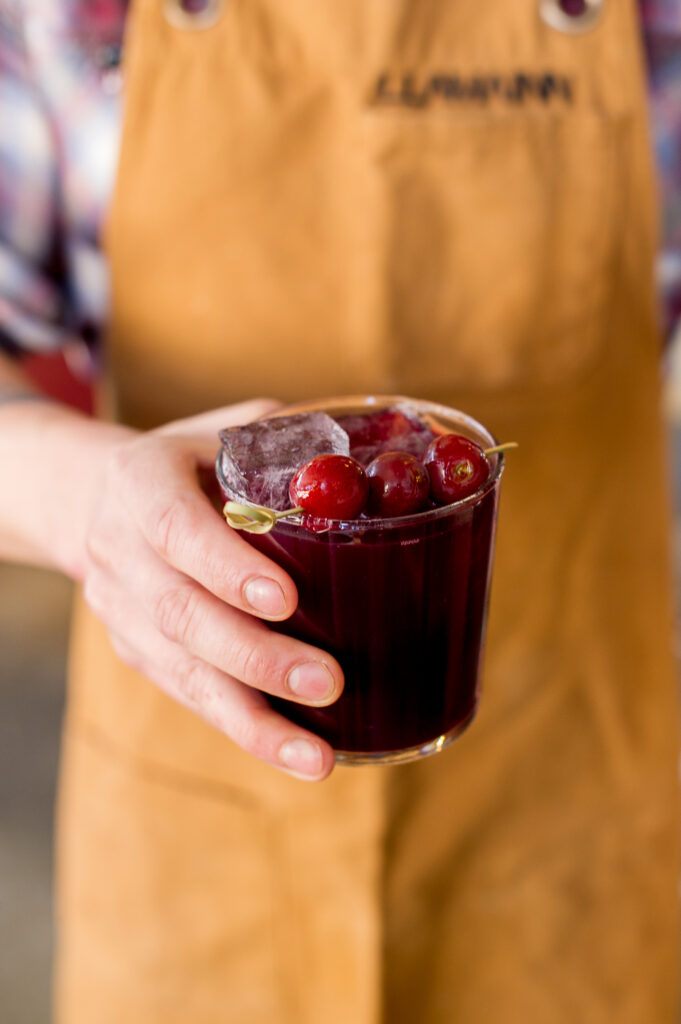 cocktail with cherries at Llama Inn a Brooklyn restaurant, photographed by Connecticut-based food photographer Rebecca Hales