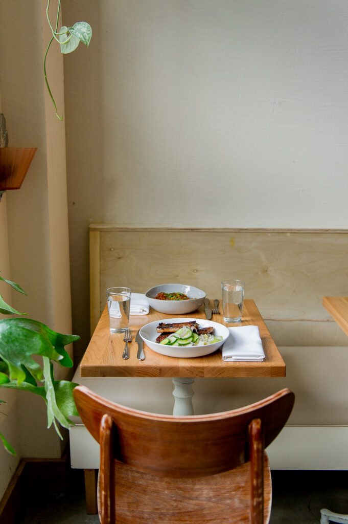 Dinner table spread at Manhattan Restaurant, shot by food photographer Rebecca Hales